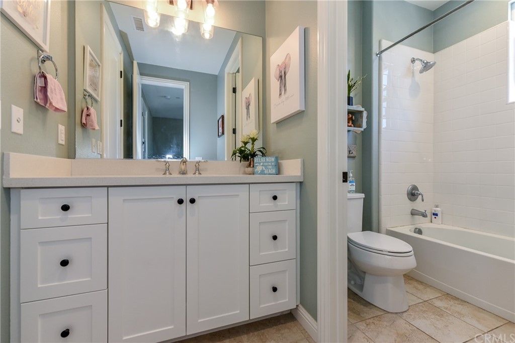 18 Tomango Lake Forest, CA 92630 - Photo 23 of 45 a bathroom with a sink vanity mirror and toilet