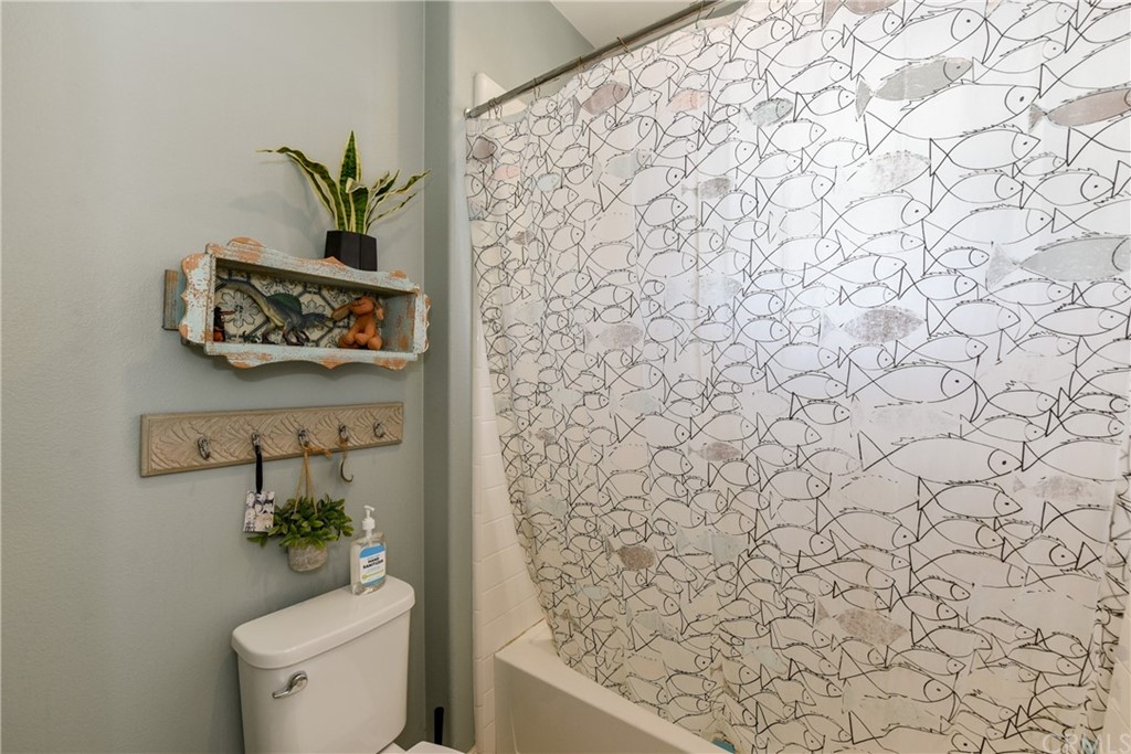 18 Tomango Lake Forest, CA 92630 - Photo 24 of 45 a bathroom with a toilet and a shower curtain
