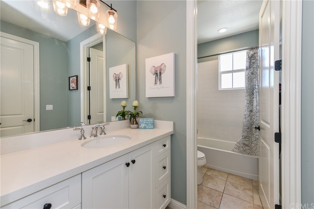18 Tomango Lake Forest, CA 92630 - Photo 26 of 45 a bathroom with a bathtub shower sink vanity and toilet