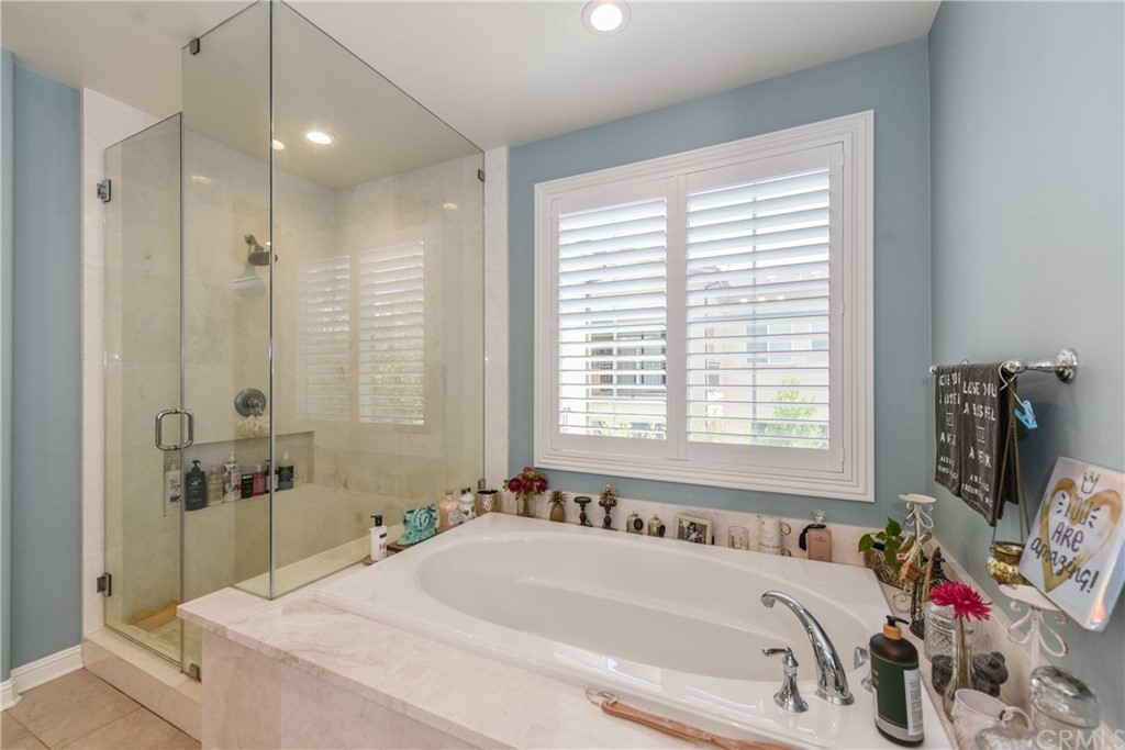 18 Tomango Lake Forest, CA 92630 - Photo 36 of 45 a bathroom with a tub sink and window