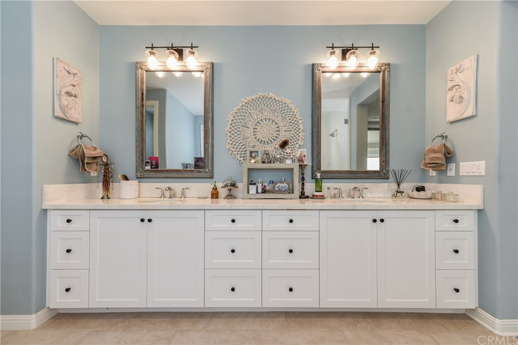 18 Tomango Lake Forest, CA 92630 - Photo 38 of 45 a bathroom with double vanity white cabinets and a mirror