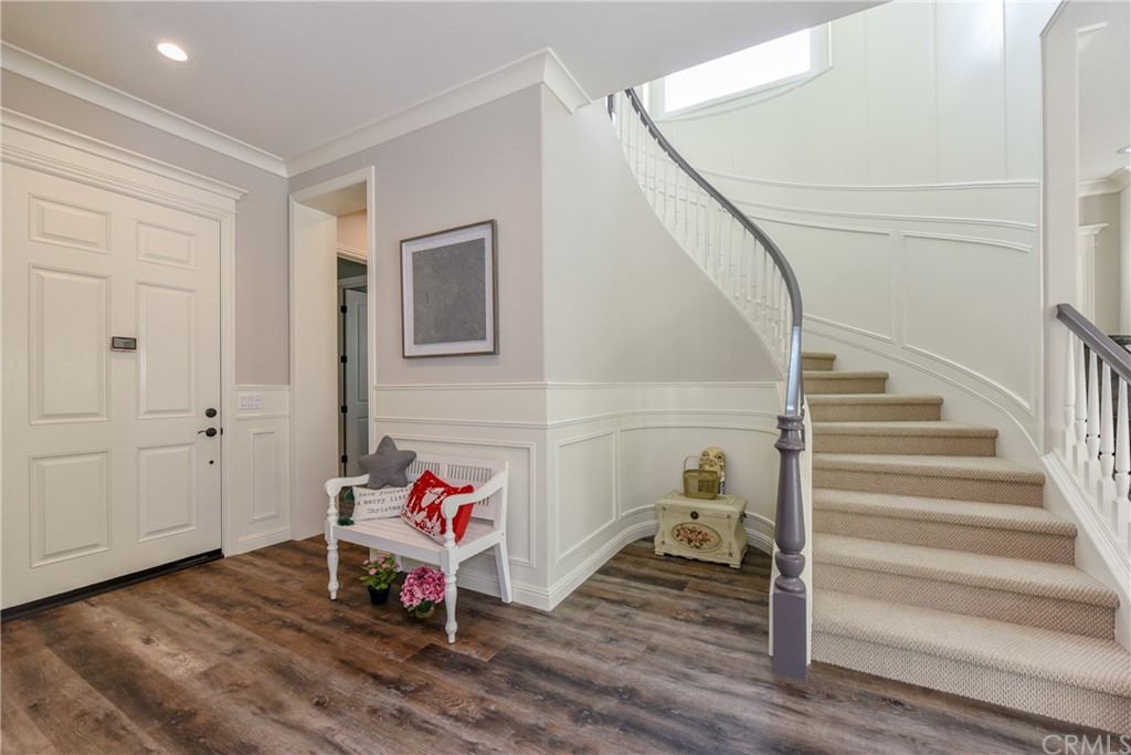 18 Tomango Lake Forest, CA 92630 - Photo 5 of 45 a living room with stairs and a wooden floor