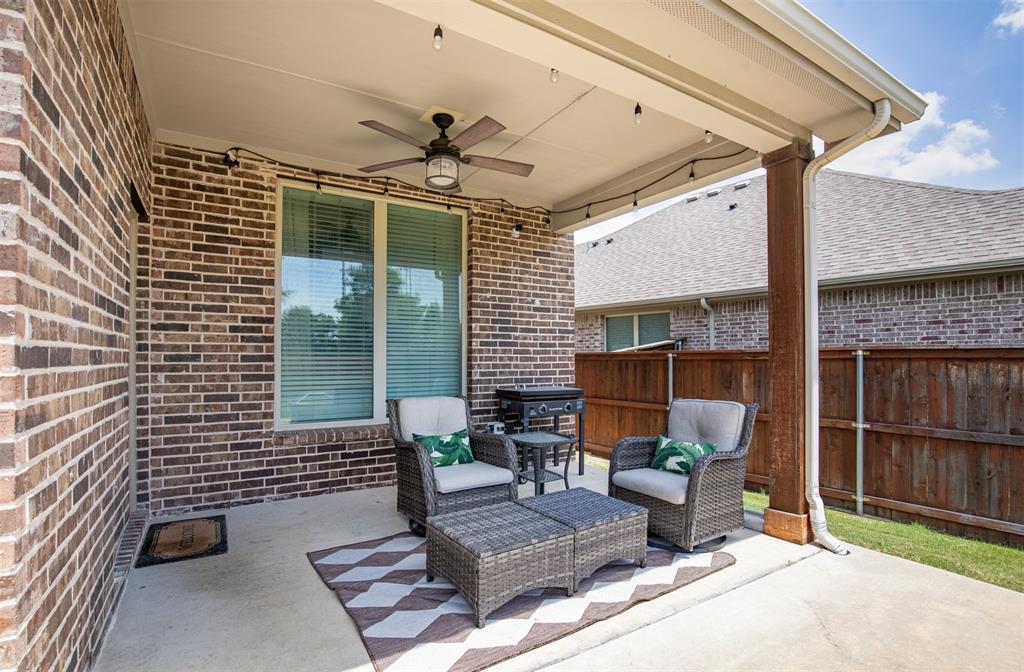 717 Rio Concho Trail McKinney, TX 75071 - Photo 33 of 37 Covered back patio with ceiling fan.