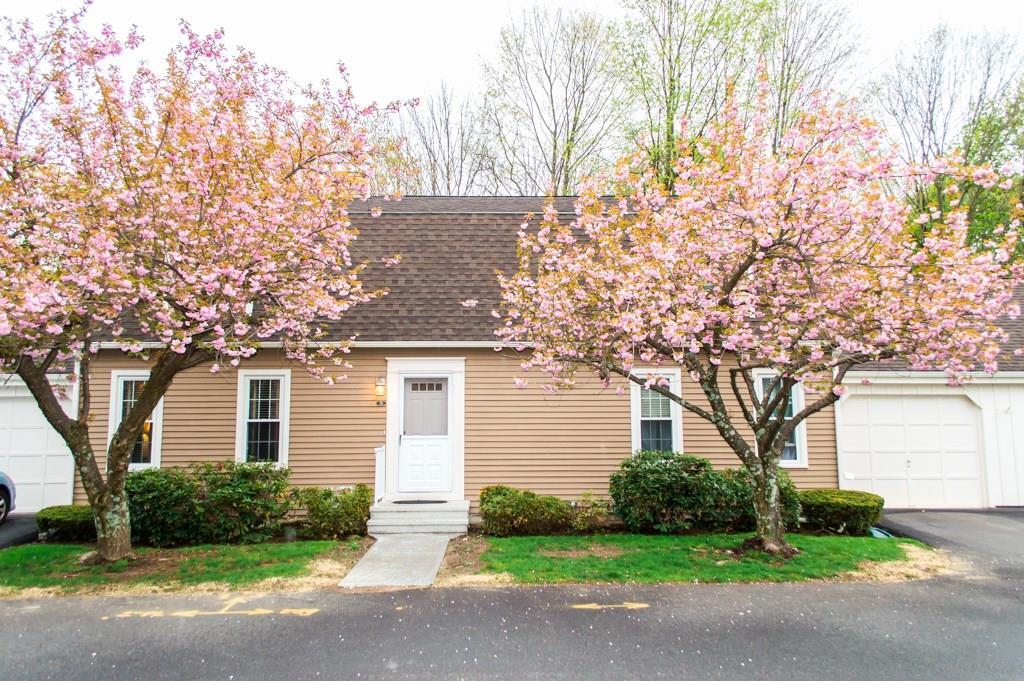151 Old Towne Road, Unit 151 Cheshire, CT 06410 - Photo 1 of 1 a front view of a house with garden