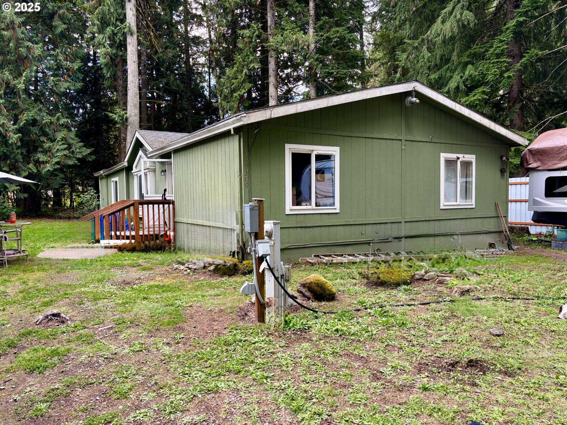 69300 East Vine Maple Drive Rhododendron, OR 97049 - Photo 1 of 16 a house with trees in the background