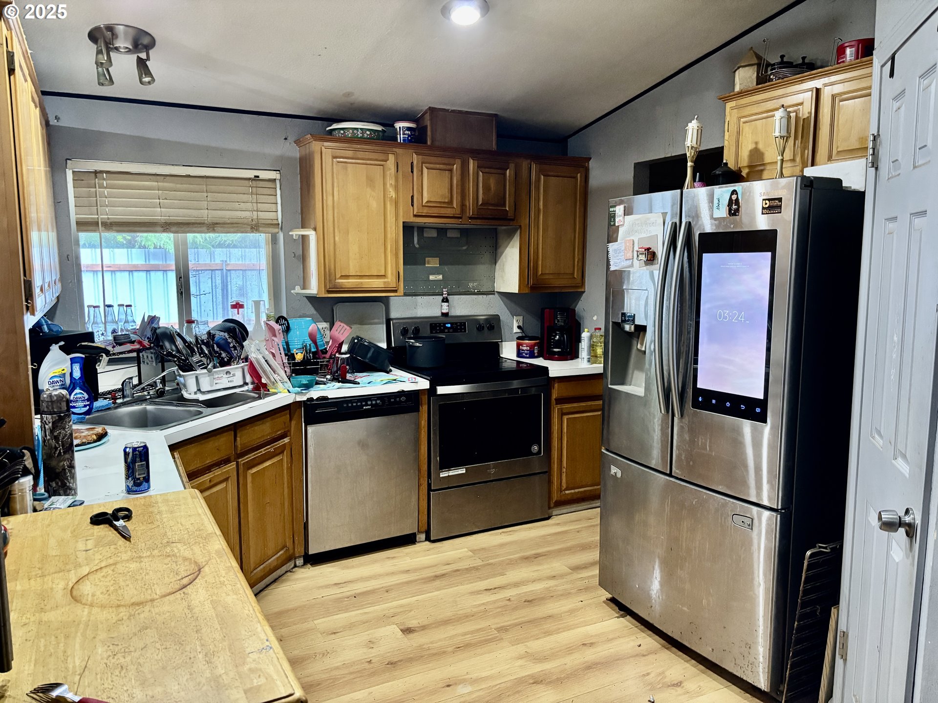 69300 East Vine Maple Drive Rhododendron, OR 97049 - Photo 2 of 16 a kitchen with stainless steel appliances a refrigerator sink and cabinets
