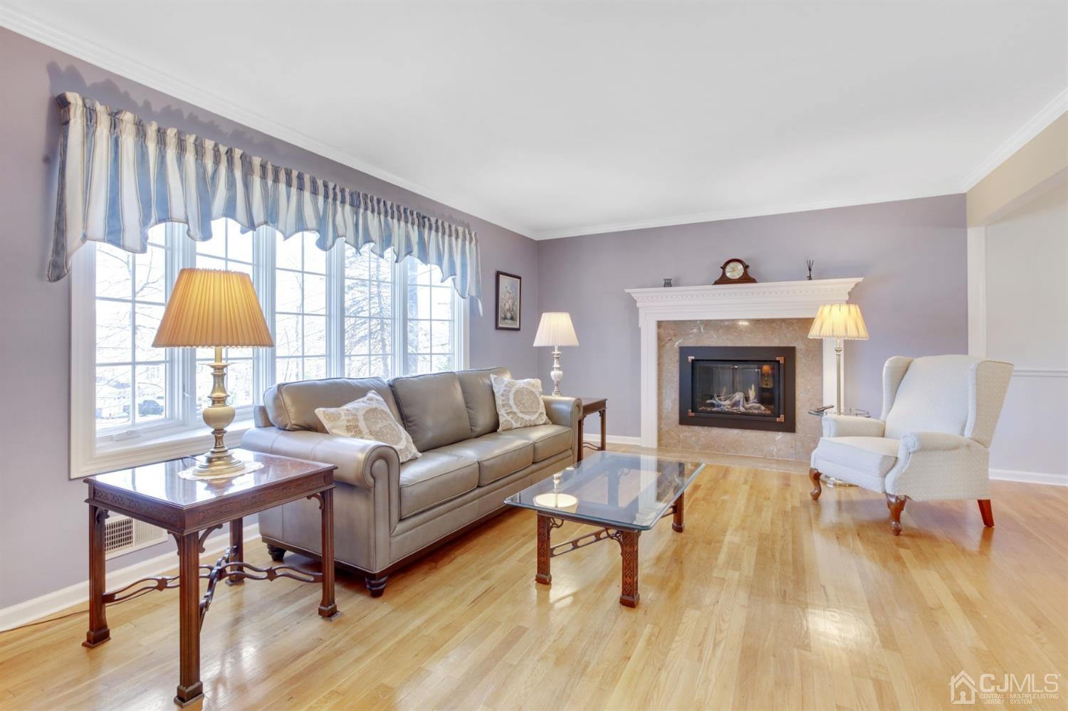 975 Carteret Road Bridgewater, NJ 08807 - Photo 4 of 25 a living room with furniture and a fireplace