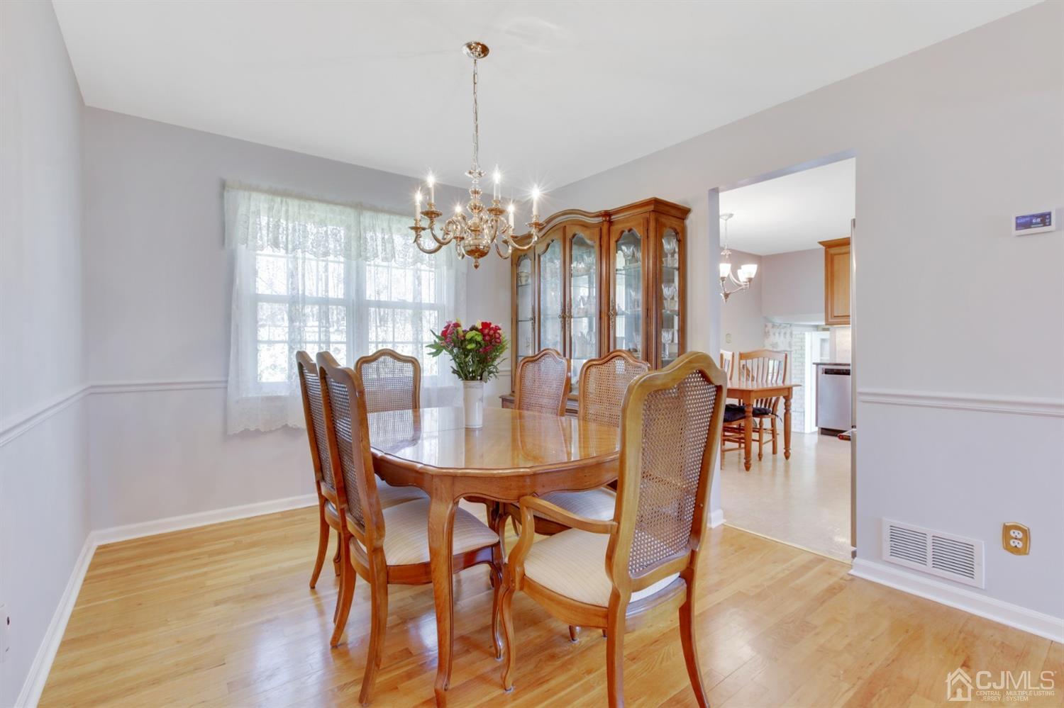 975 Carteret Road Bridgewater, NJ 08807 - Photo 6 of 25 a view of a dining room with furniture and chandelier