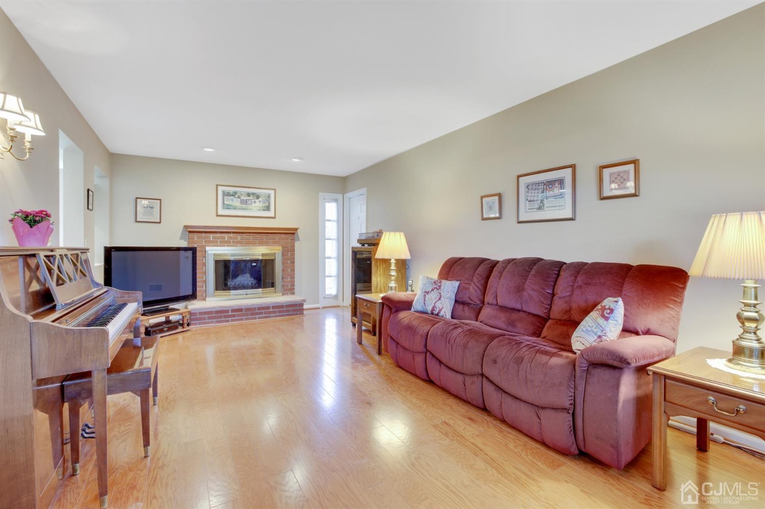 975 Carteret Road Bridgewater, NJ 08807 - Photo 10 of 25 a living room with furniture and a fireplace