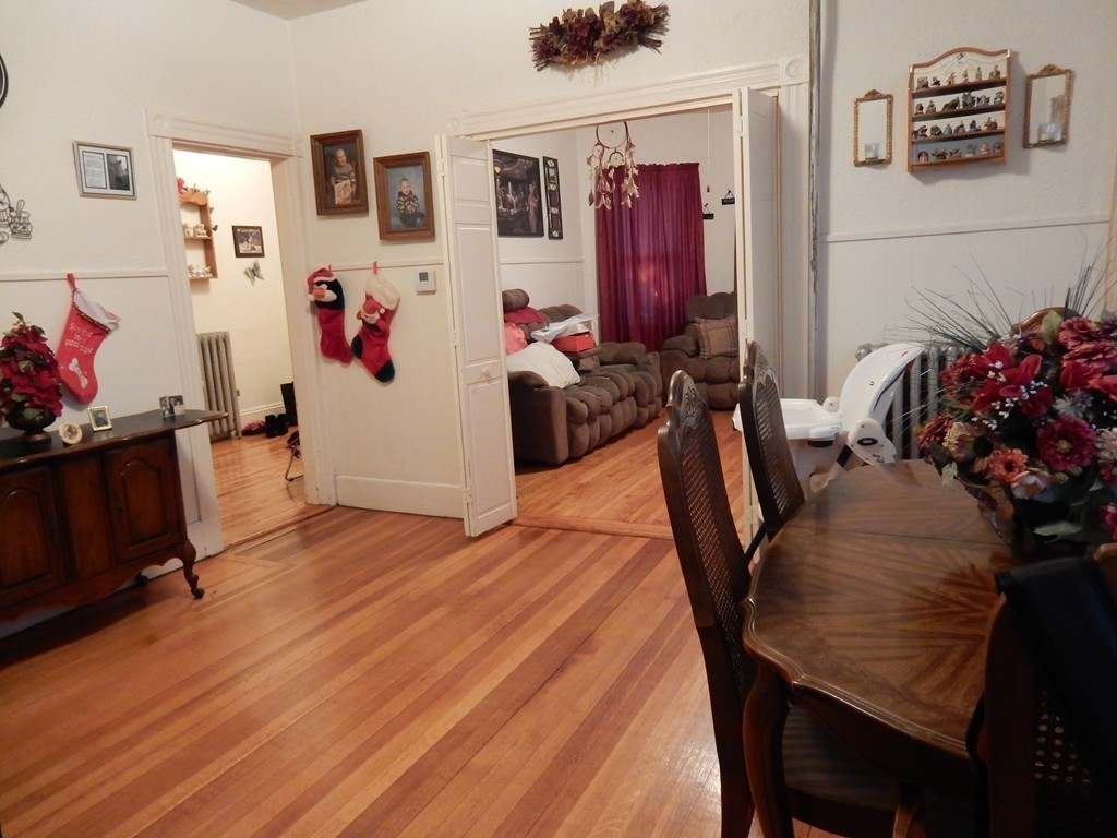 63 Bucknam Street Everett, MA 02149 - Photo 11 of 28 a view of a workspace with furniture and toys