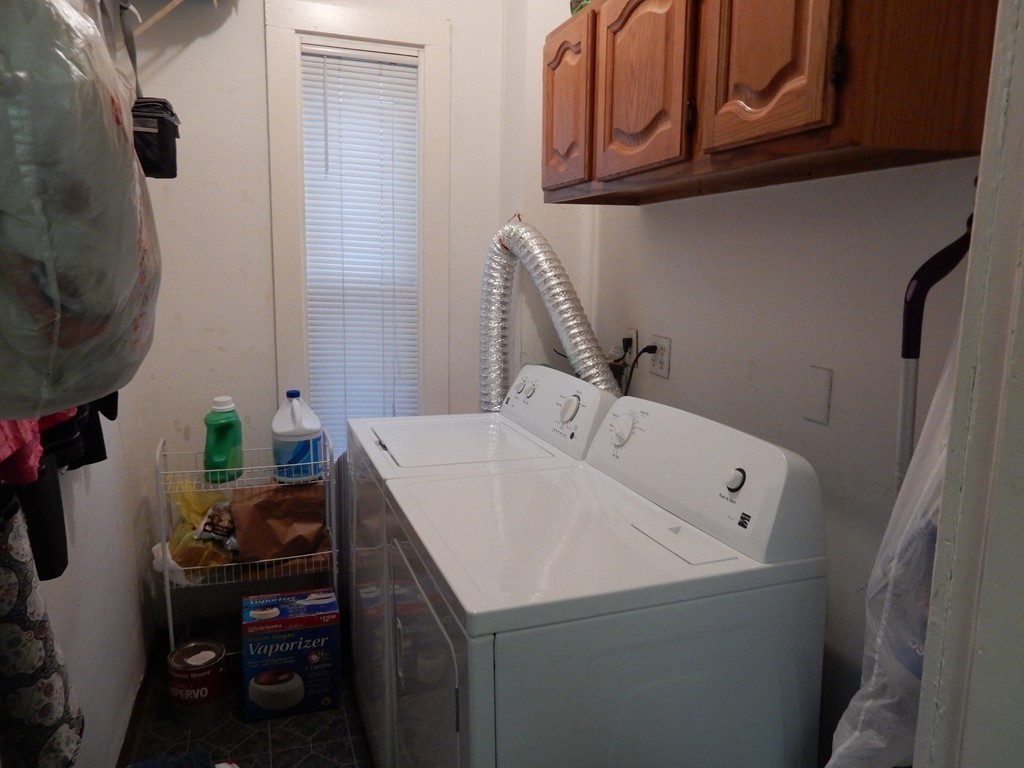 63 Bucknam Street Everett, MA 02149 - Photo 13 of 28 a bathroom with a sink and a mirror