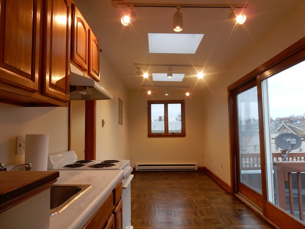 63 Bucknam Street Everett, MA 02149 - Photo 17 of 28 a view of a room with gym equipment