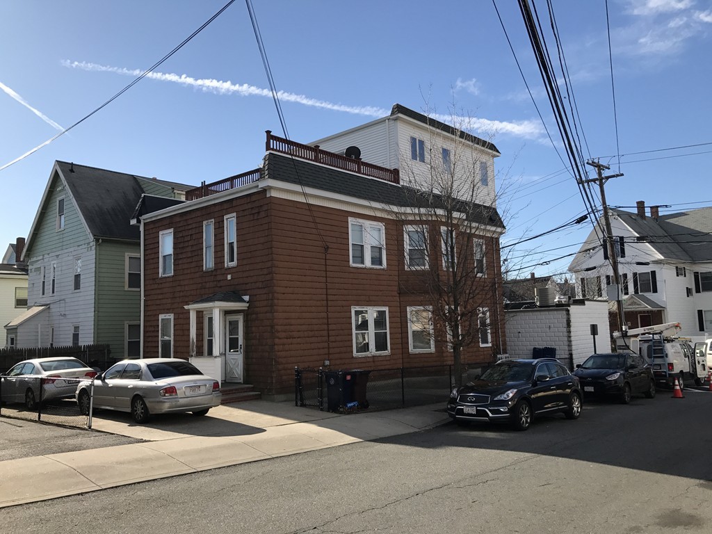 63 Bucknam Street Everett, MA 02149 - Photo 2 of 28 a car parked in front of a building