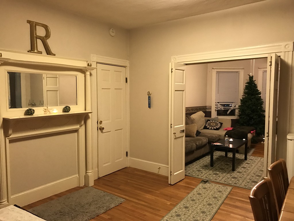 63 Bucknam Street Everett, MA 02149 - Photo 28 of 28 a view of a hallway with workspace and mirror