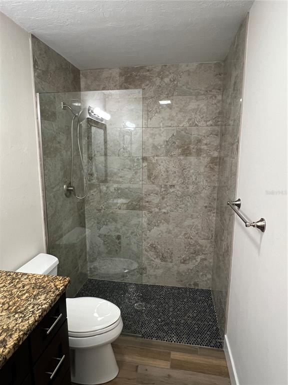 511 West Retta Esplanade Punta Gorda, FL 33950 - Photo 17 of 19 a bathroom with a toilet and a shower