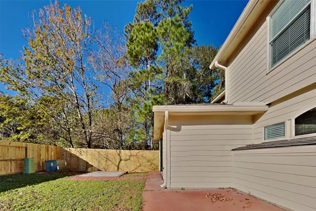 a view of a tree front of house