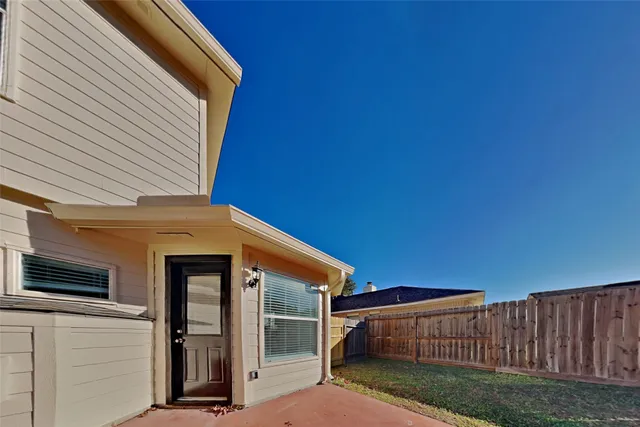 a view of backyard with cabin