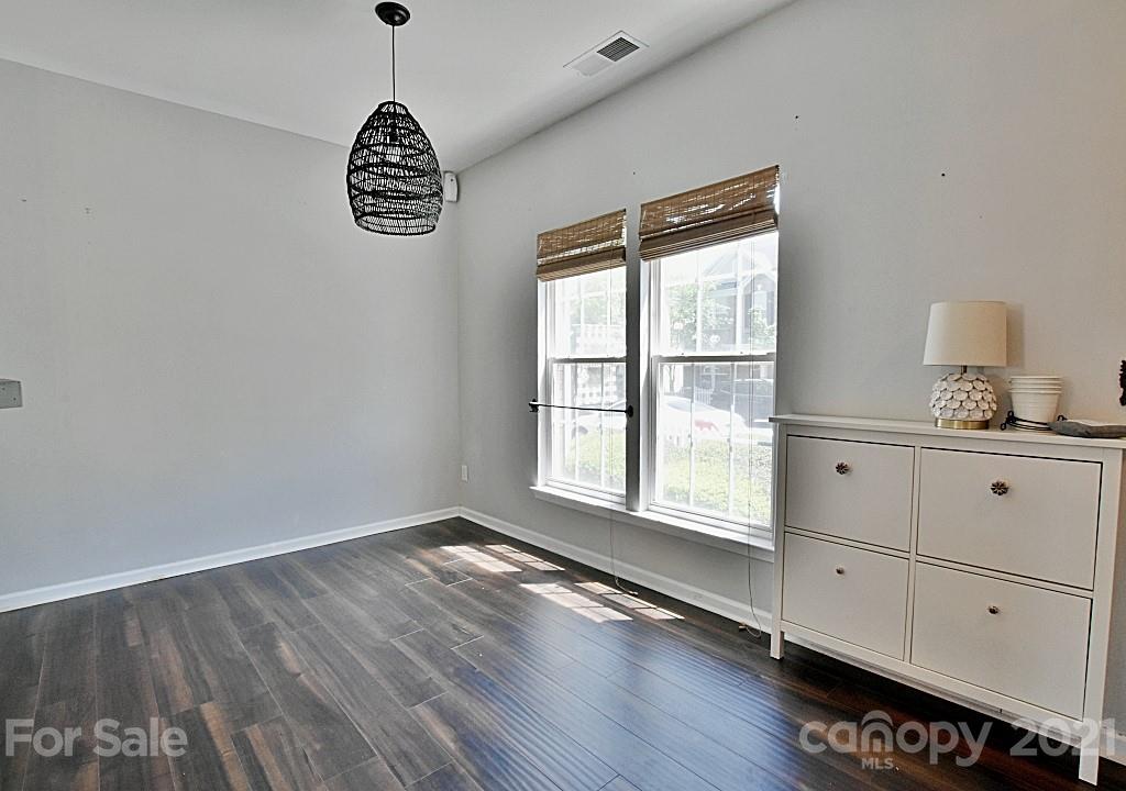 821 Dillard Road Rock Hill, SC 29730 - Photo 5 of 21 a view of an empty room with a window and wooden floor