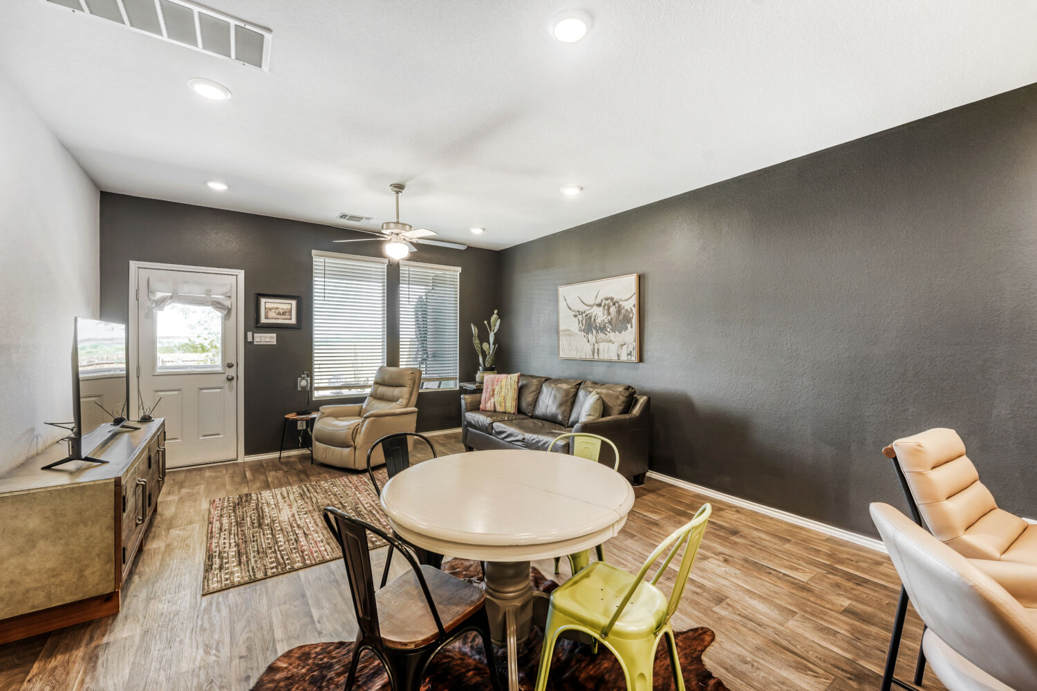 549 Arnold Loop, Unit A Kyle, TX 78640 - Photo 3 of 16 a view of a dining room with furniture and a chandelier