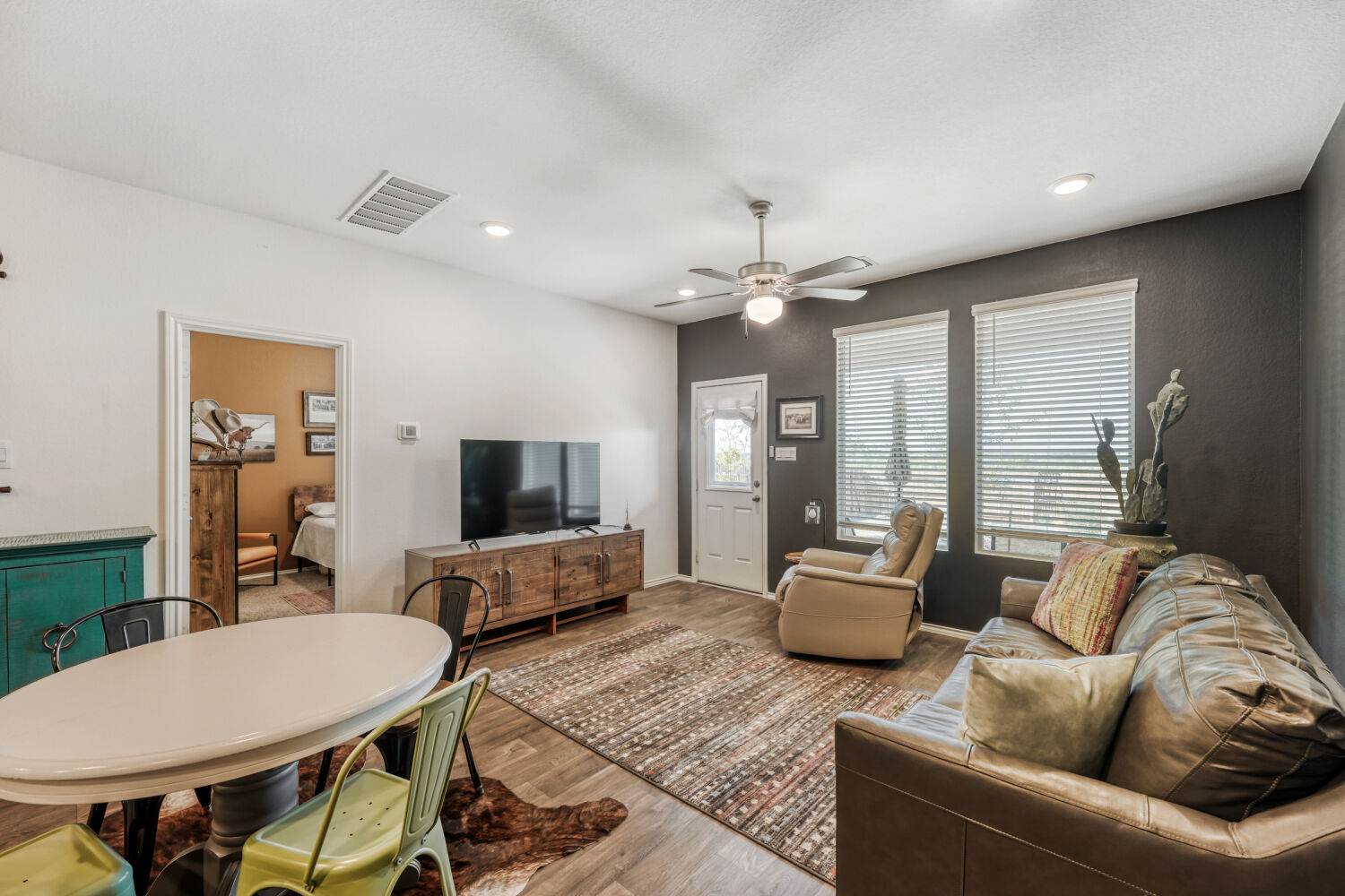 549 Arnold Loop, Unit A Kyle, TX 78640 - Photo 4 of 16 a living room with furniture and a flat screen tv