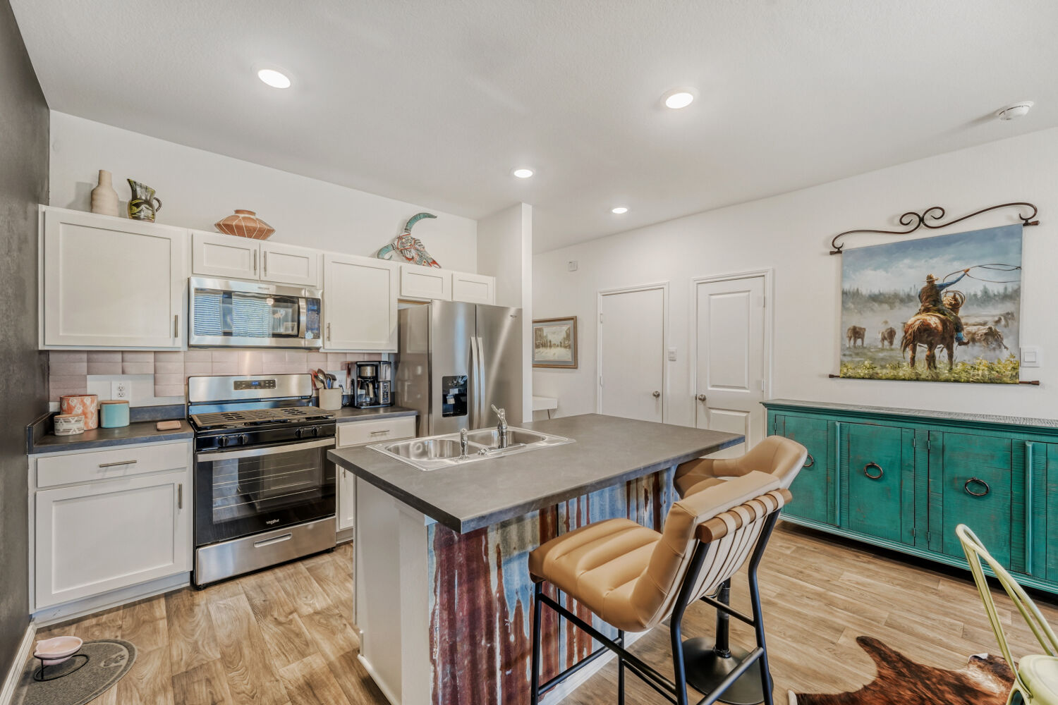 549 Arnold Loop, Unit A Kyle, TX 78640 - Photo 7 of 16 a kitchen that has a table and chairs in it