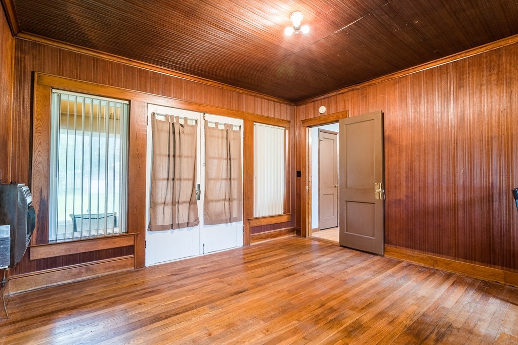 200 Beaverdale Road Northeast Dalton, GA 30721 - Photo 17 of 38 a view of an empty room with wooden floor and a window
