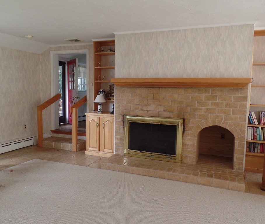 270 Beaver Dam Road Scituate, MA 02066 - Photo 5 of 7 a view of a livingroom with an empty space and fireplace