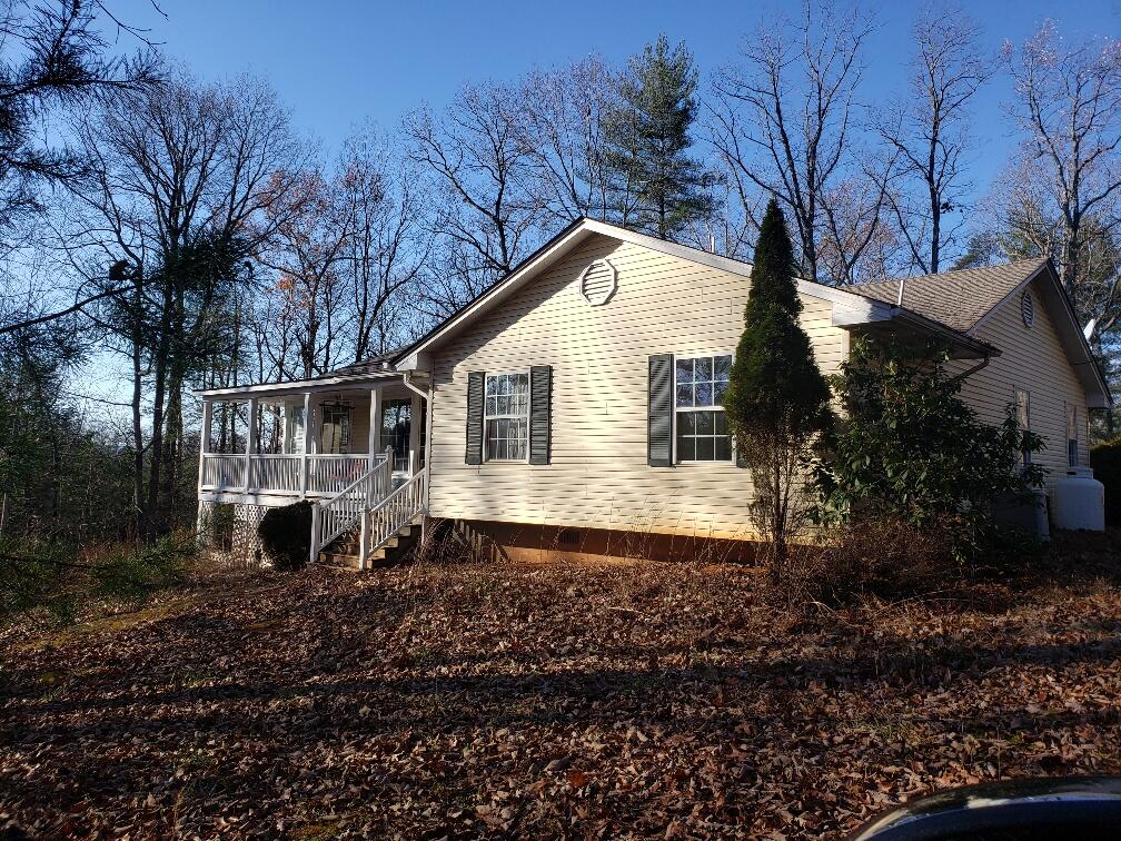 a back view of a house with a yard