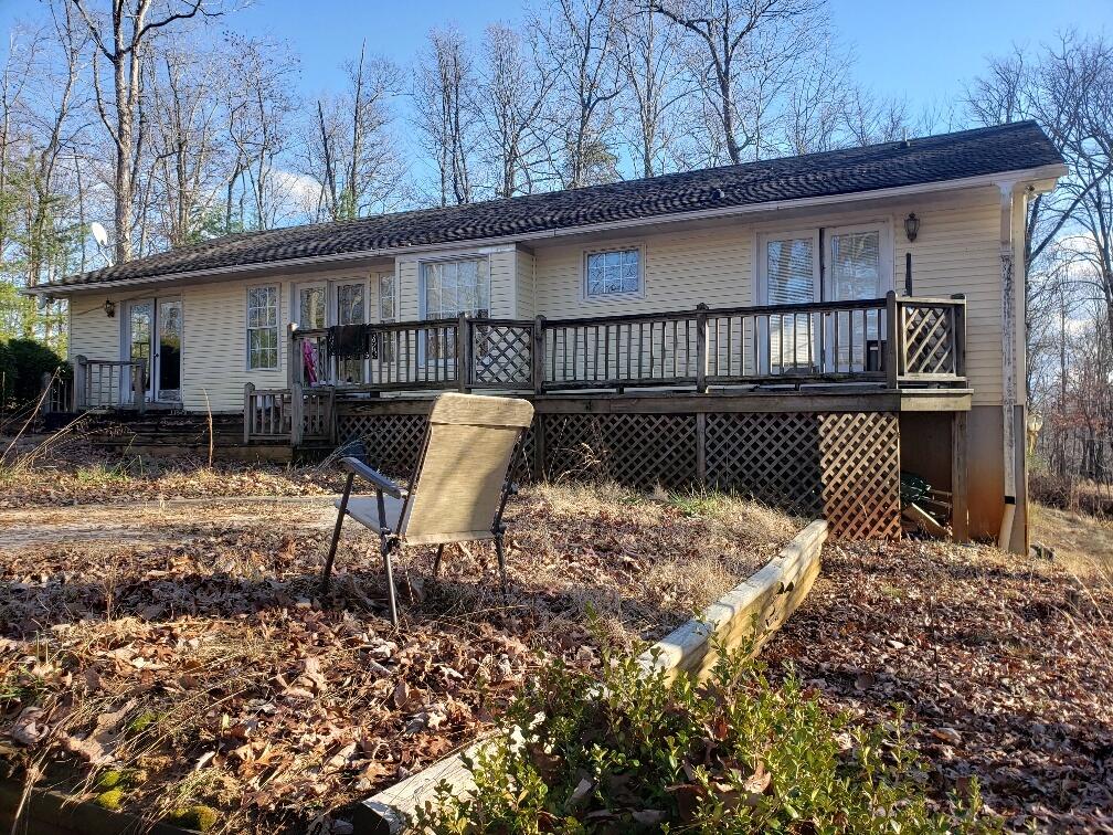 65 Middle Valley Road Hardy, VA 24101 - Photo 2 of 13 a view of backyard with deck and furniture