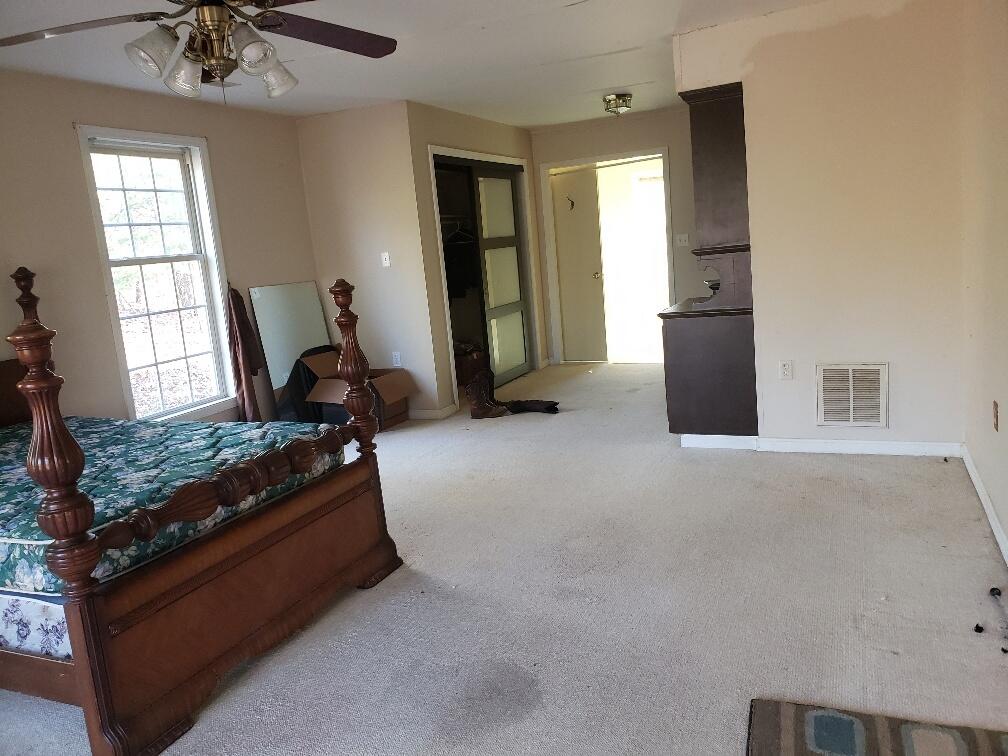 65 Middle Valley Road Hardy, VA 24101 - Photo 5 of 13 a living room with furniture gym equipment and a window