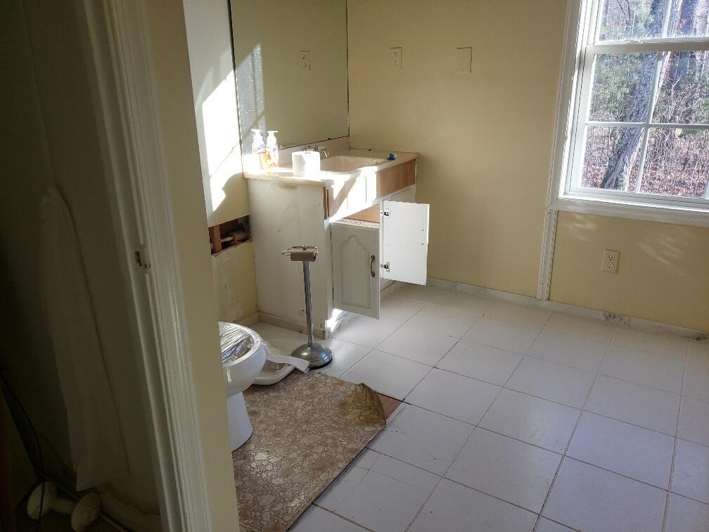 65 Middle Valley Road Hardy, VA 24101 - Photo 6 of 13 a bathroom with a granite countertop sink and a toilet