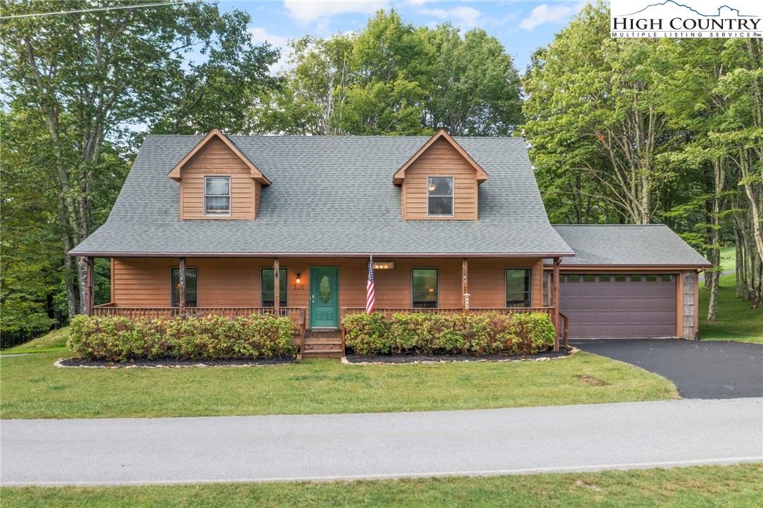 105 Old Field Road Beech Mountain, NC 28604 - Photo 1 of 43 a front view of a house with a yard