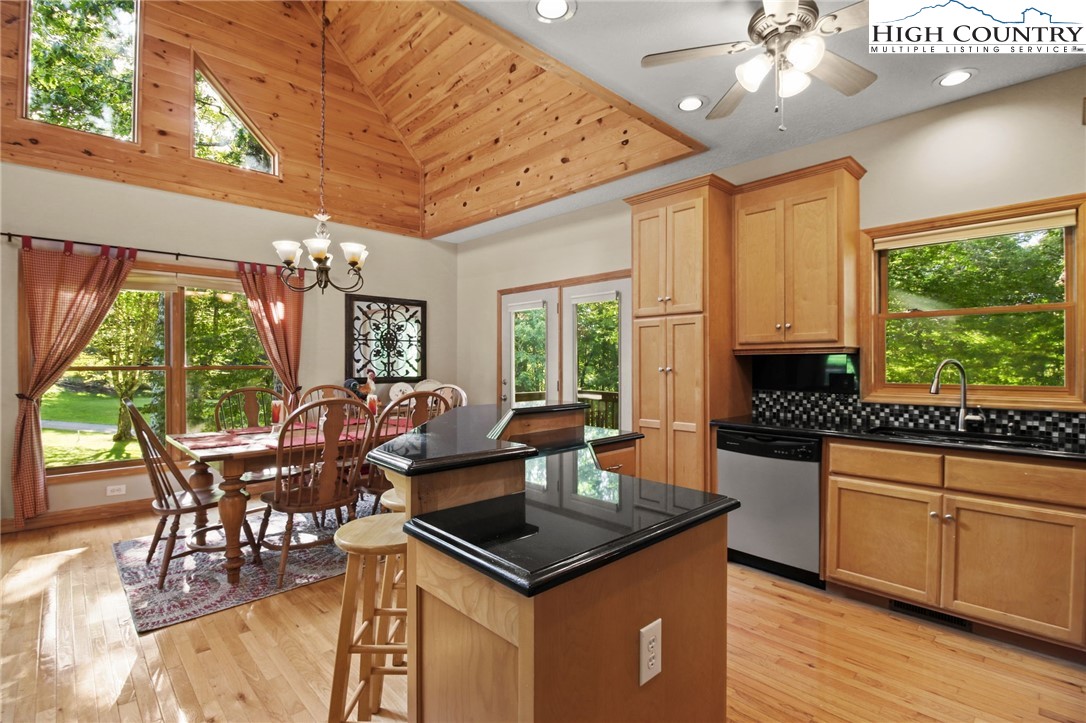 105 Old Field Road Beech Mountain, NC 28604 - Photo 25 of 43 a view of a dining room with furniture window and outside view