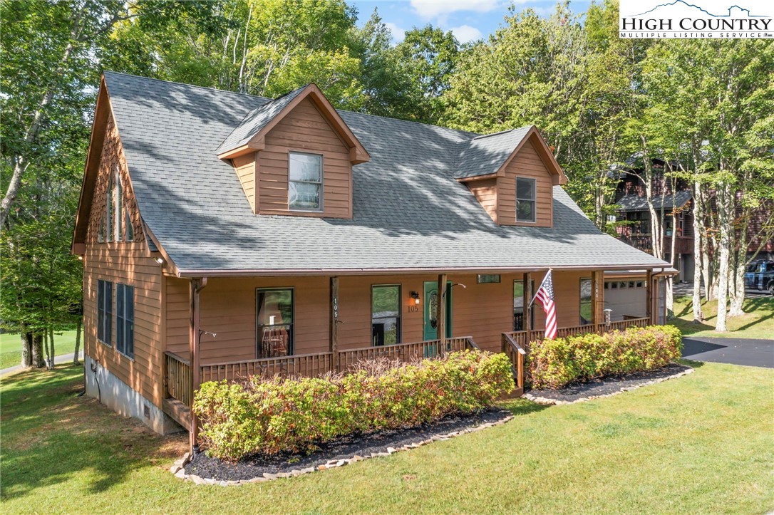 105 Old Field Road Beech Mountain, NC 28604 - Photo 3 of 43 front view of a house with a yard