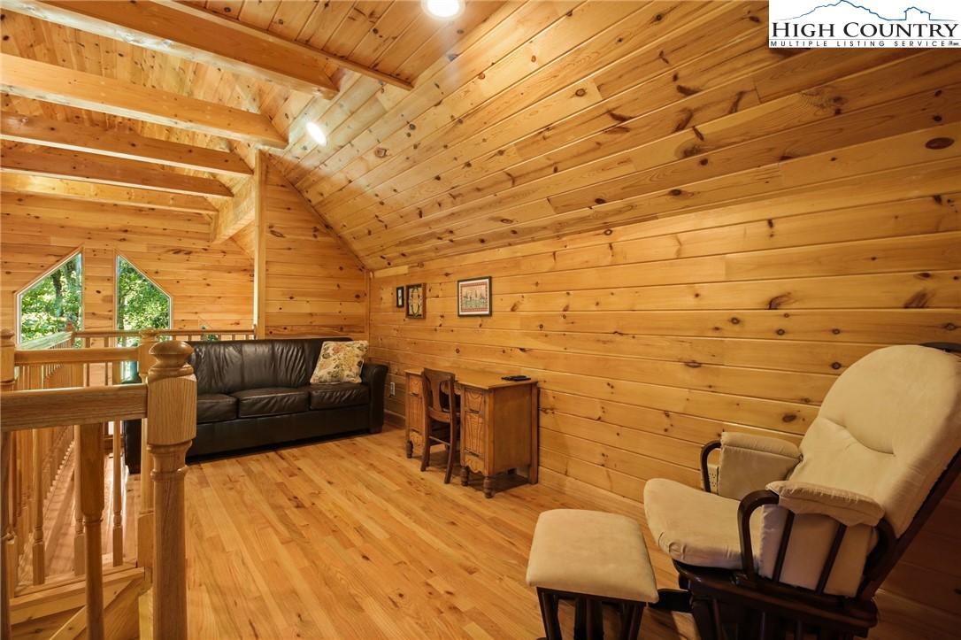 105 Old Field Road Beech Mountain, NC 28604 - Photo 36 of 43 a balcony with chairs and wooden floor