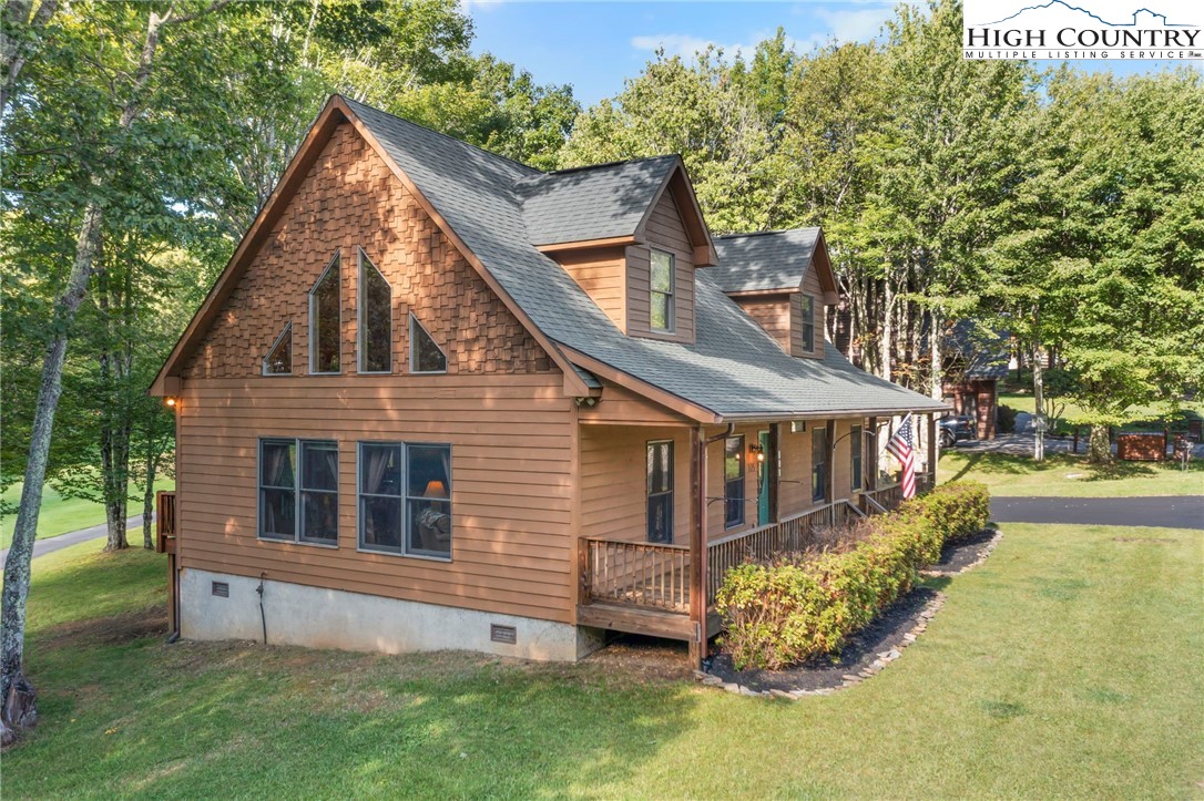 105 Old Field Road Beech Mountain, NC 28604 - Photo 4 of 43 a view of house with a yard
