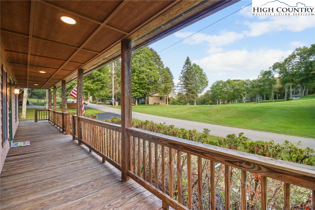 105 Old Field Road Beech Mountain, NC 28604 - Photo 6 of 43 a view of a porch with wooden floor and outdoor space