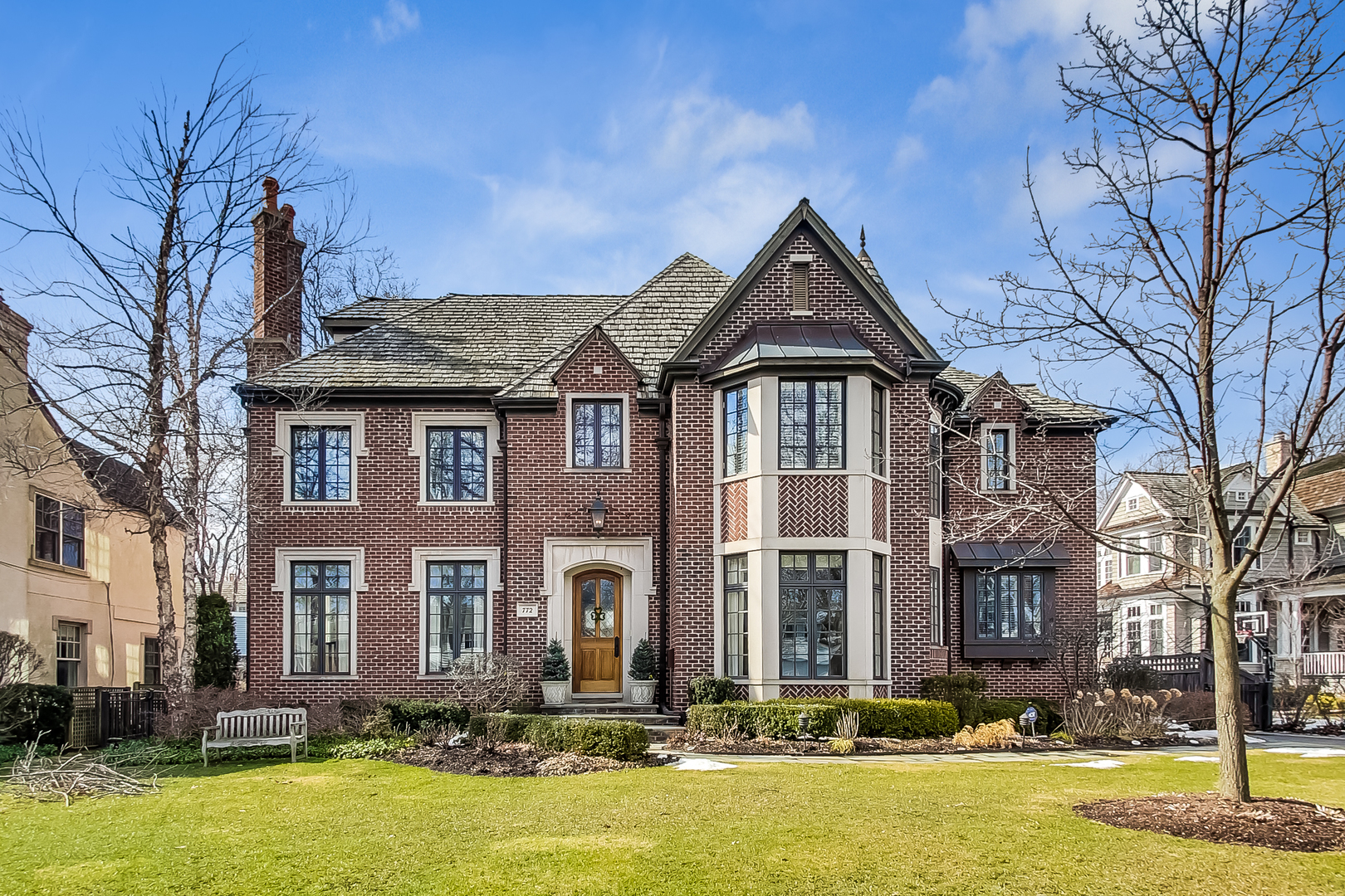 a front view of a house with a yard table and chairs