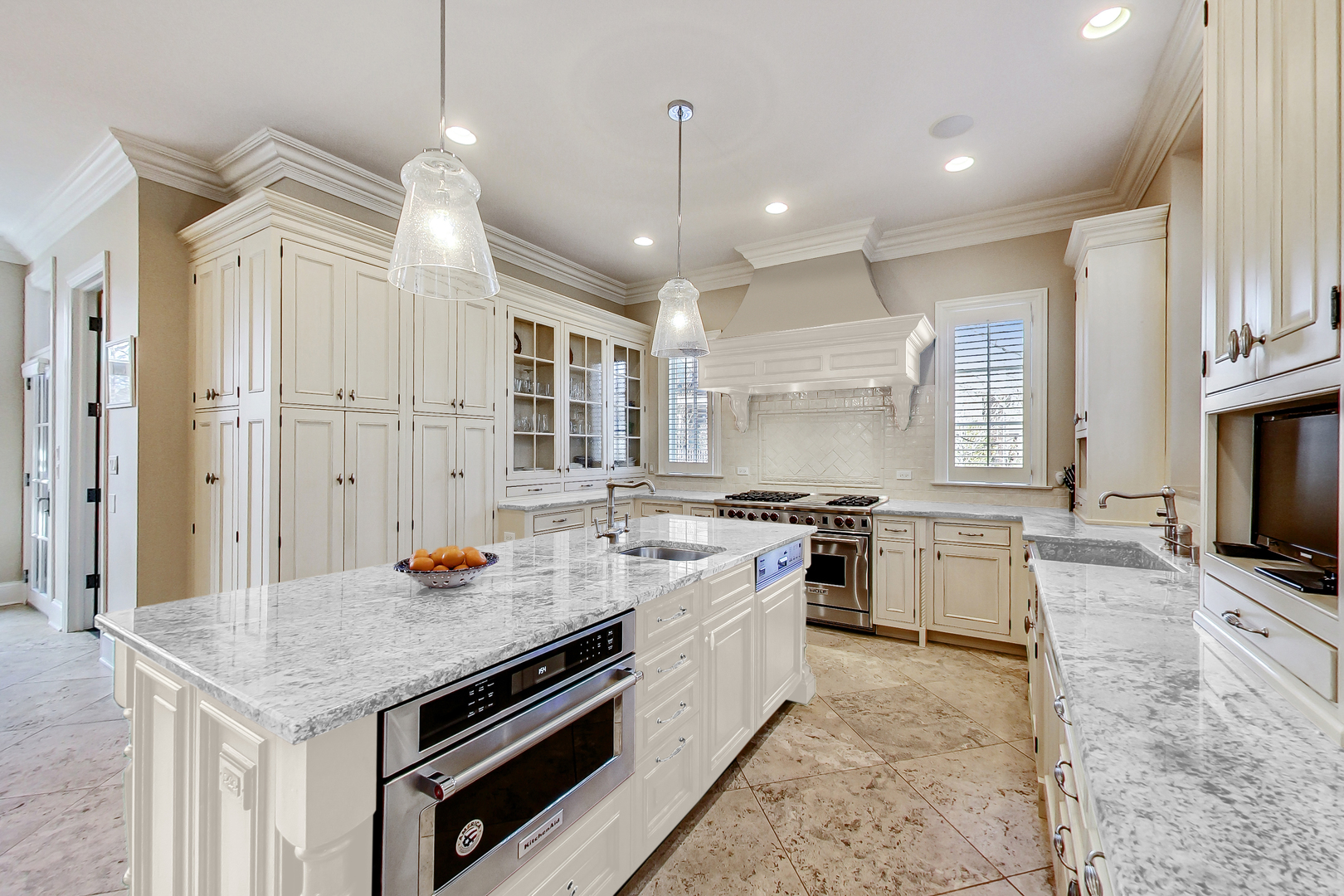 772 Walden Road Winnetka, IL 60093 - Photo 11 of 55 a kitchen with a stove a sink a kitchen island with wooden cabinets and floor