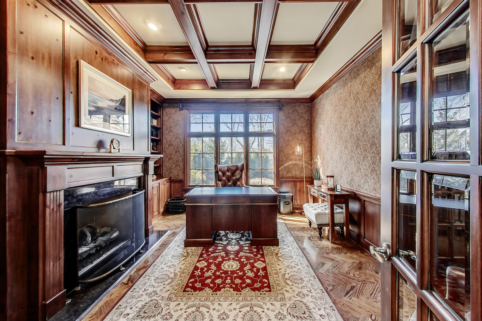 772 Walden Road Winnetka, IL 60093 - Photo 20 of 55 a living room with furniture a fireplace and a table