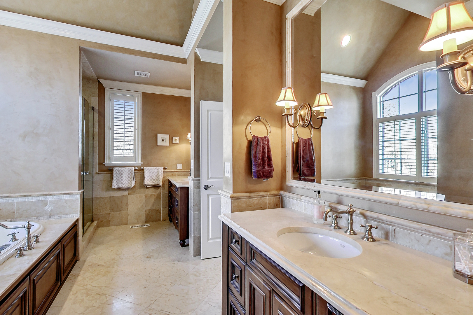 772 Walden Road Winnetka, IL 60093 - Photo 24 of 55 a bathroom with a granite countertop sink a large mirror and a bathtub