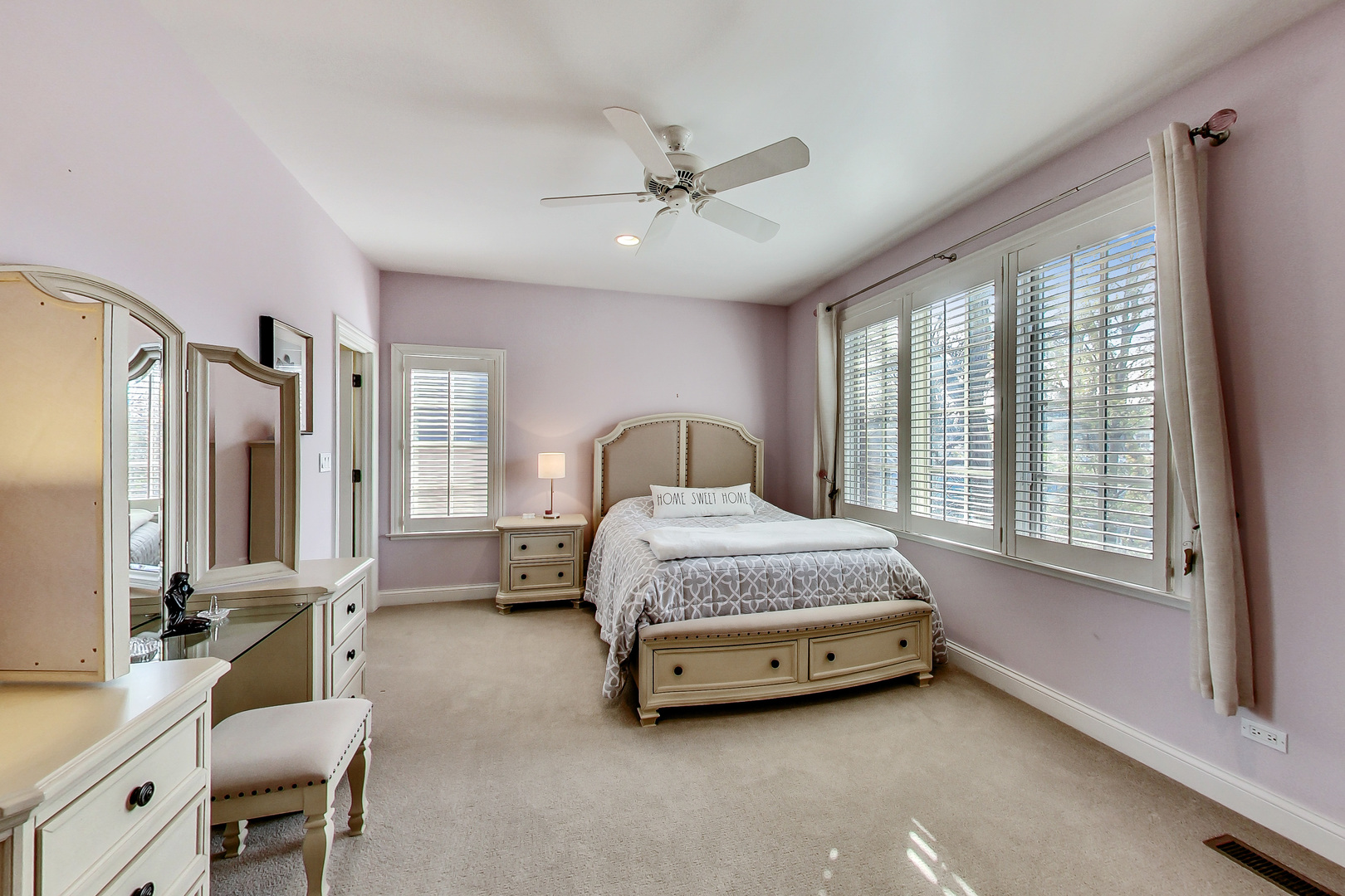 772 Walden Road Winnetka, IL 60093 - Photo 29 of 55 a spacious bedroom with a bed couch and a window