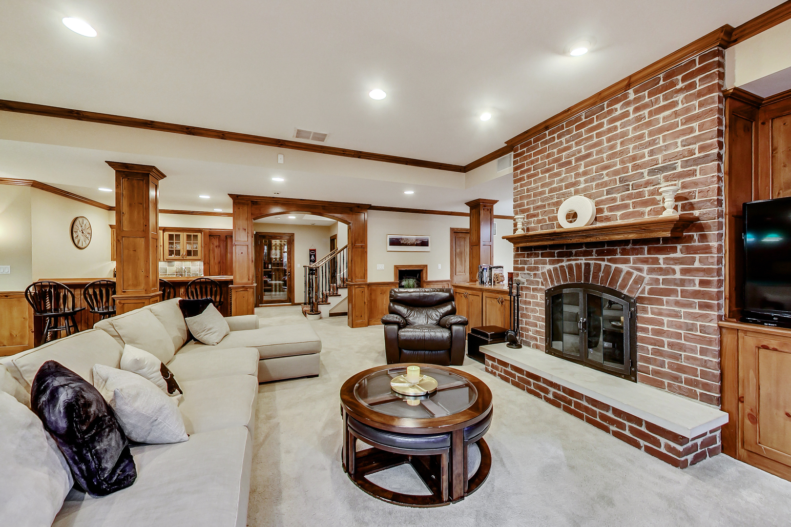 772 Walden Road Winnetka, IL 60093 - Photo 35 of 55 a living room with furniture and a fireplace