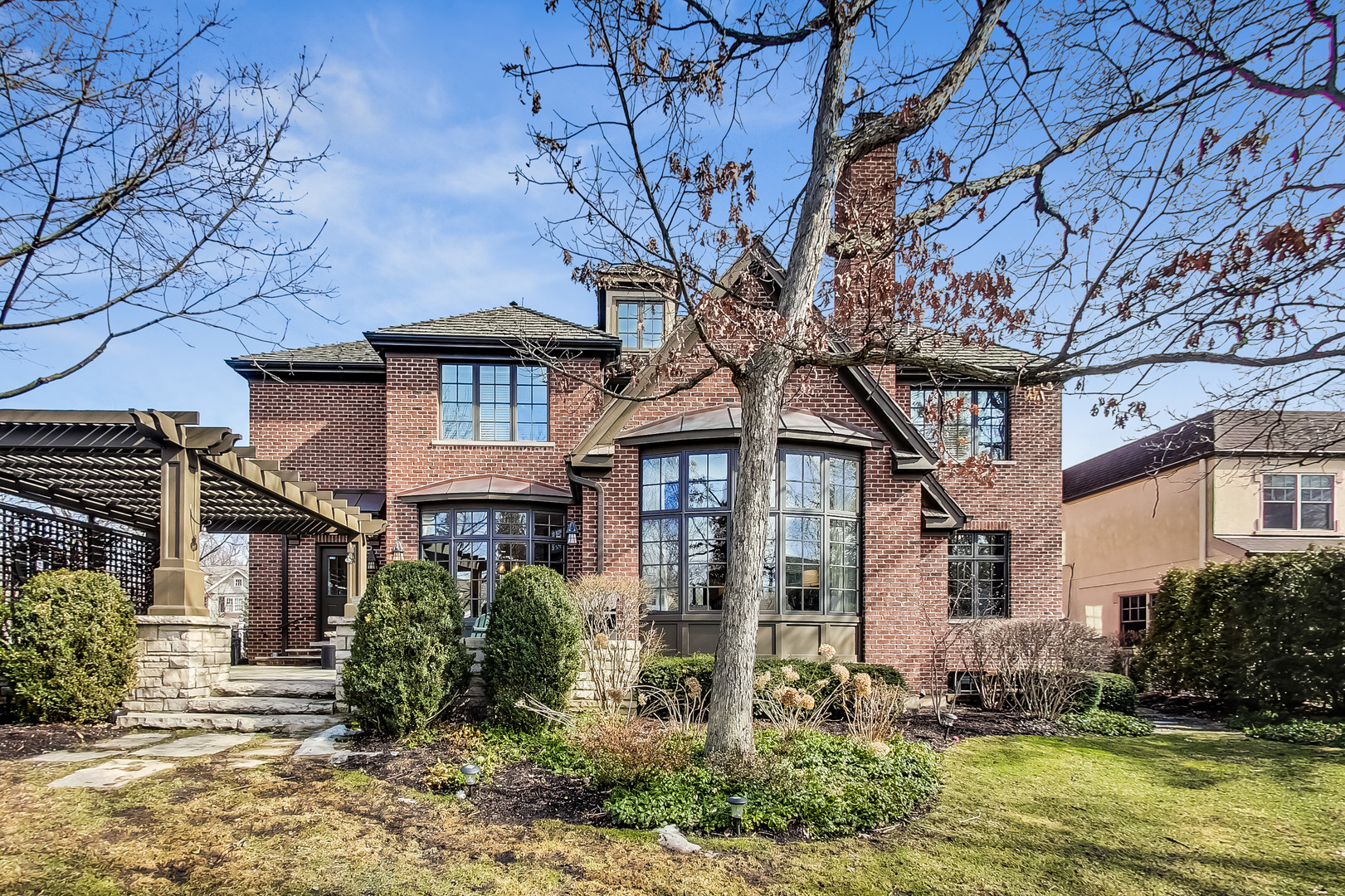 772 Walden Road Winnetka, IL 60093 - Photo 44 of 55 front view of a house with a tree in the yard