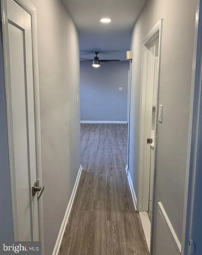 6644 North 8th Street, Unit A4 Philadelphia, PA 19126 - Photo 4 of 9 a view of a hallway with wooden floor and a ceiling fan