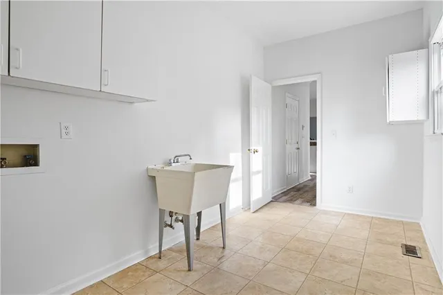 a view of a kitchen cabinets and a window
