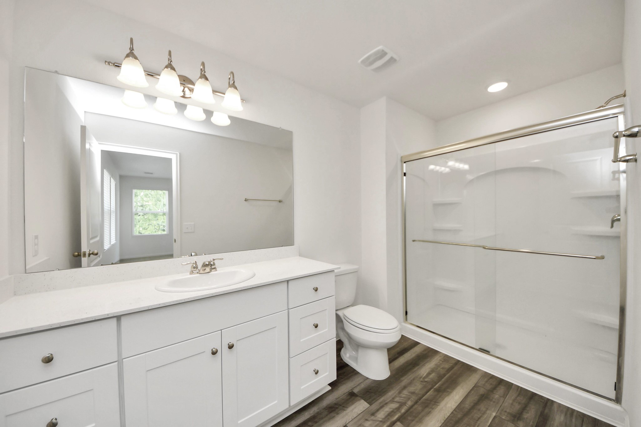 10303 Rose Mar Drive, Unit B Rosharon, TX 77583 - Photo 23 of 49 a bathroom with a double vanity sink mirror and toilet