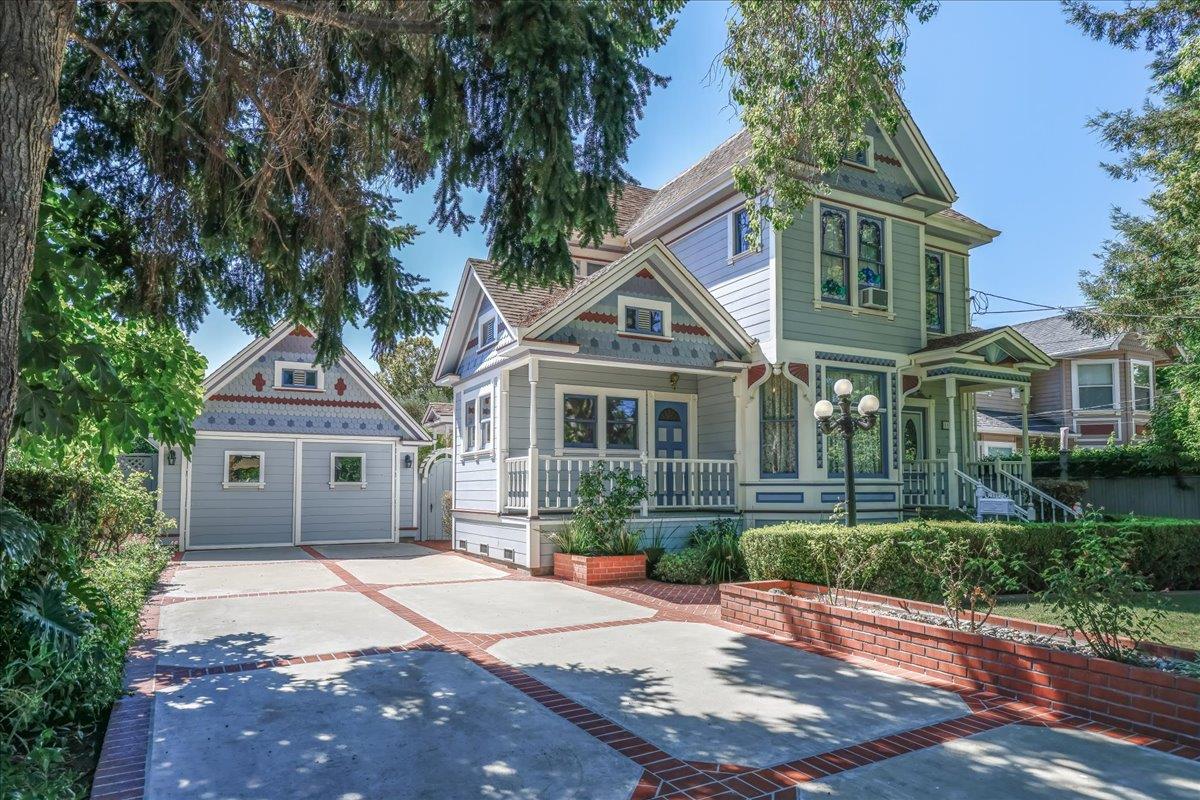 1167 Settle Avenue San Jose, CA 95125 - Photo 1 of 35 a front view of a house with a garden and trees