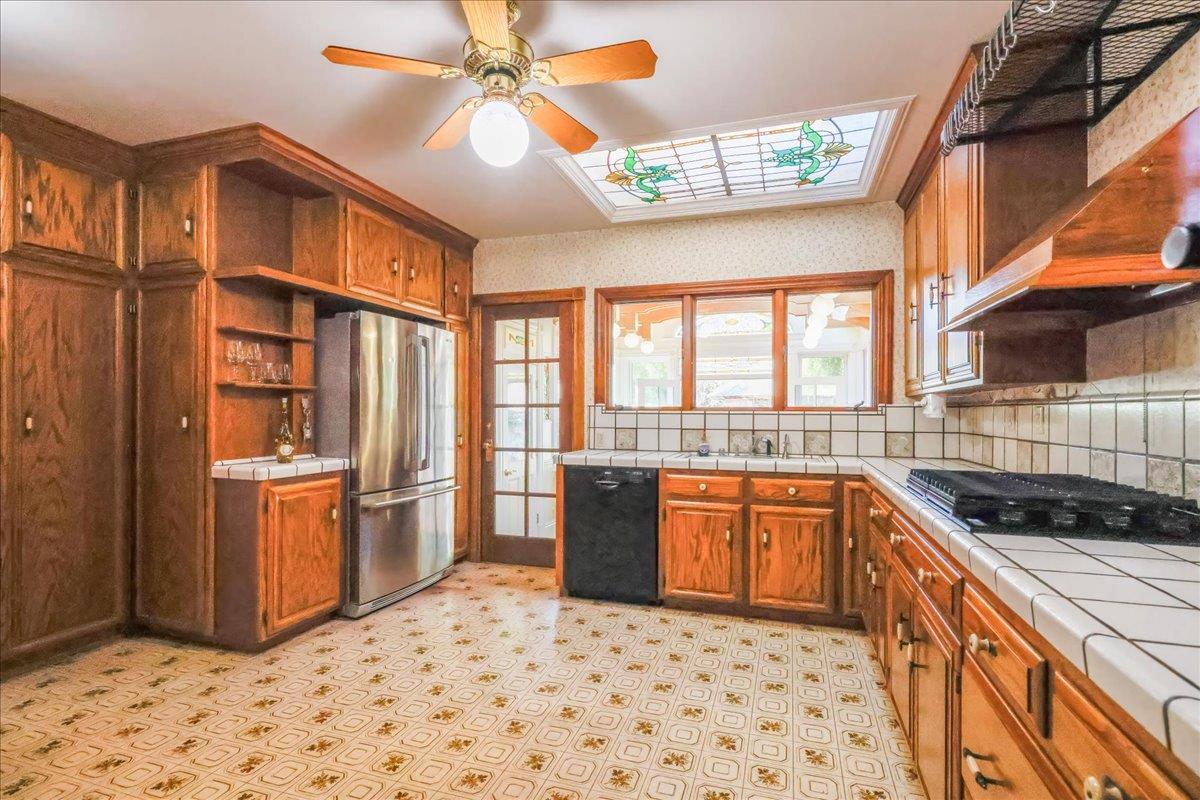 1167 Settle Avenue San Jose, CA 95125 - Photo 11 of 35 a kitchen with stainless steel appliances granite countertop a stove a sink and a refrigerator