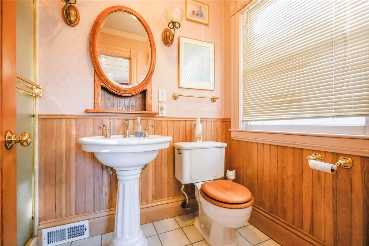 1167 Settle Avenue San Jose, CA 95125 - Photo 13 of 35 a bathroom with a sink a toilet and a mirror